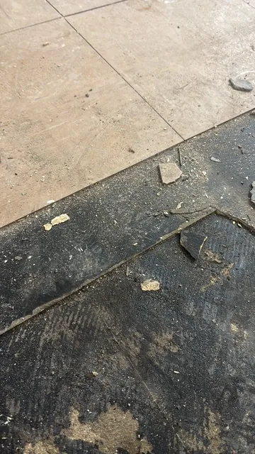 Black bitumen mastic floor removal in a W4 flat